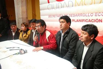Los secretarios en la conferencia de prensa.