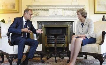 May quiere que Bruselas colabore para lograr una "suave" salida de la UE