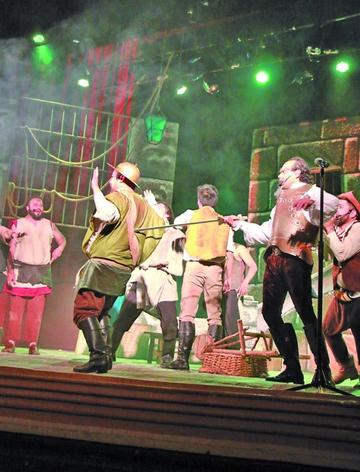 Los actores en una parte de la pieza de teatro.