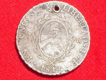 Esta moneda es de ocho reales.
