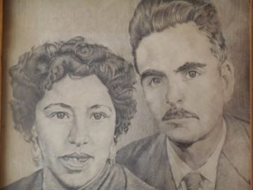 Sus padres, Dora y José.