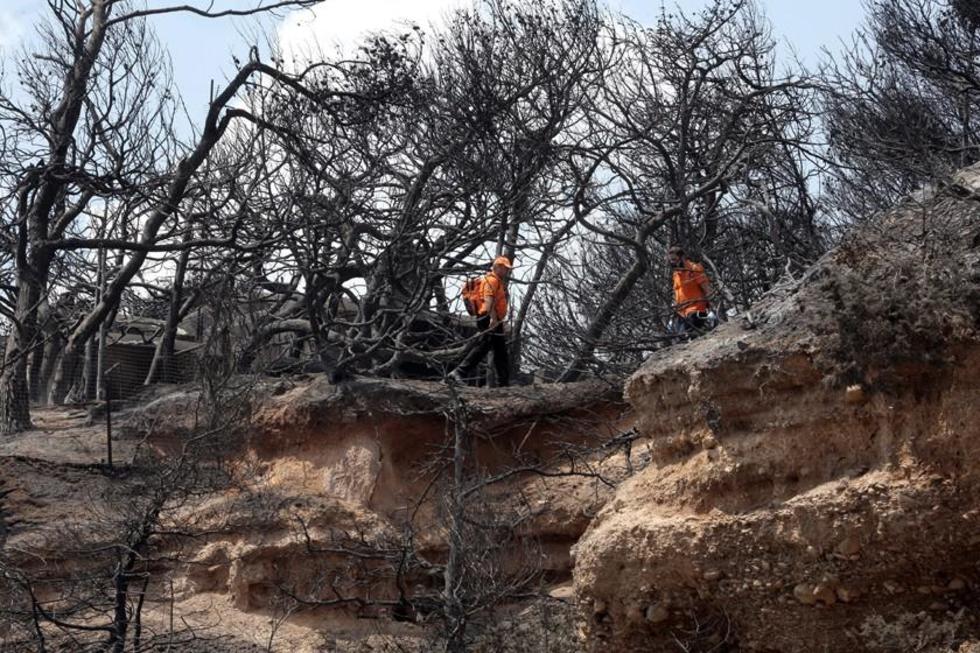 Grecia busca desaparecidos tras los incendios con inundaciones